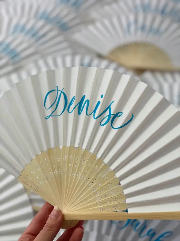 Personalised paper fans for wedding guests
